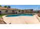 A backyard pool and patio area is perfect for relaxing and soaking up the summer sun at 4134 W Camino Acequia --, Phoenix, AZ 85051