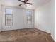 Spacious bedroom with carpeting and multiple windows at 4241 E Bonanza Rd, Gilbert, AZ 85297