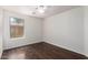 Bedroom with hardwood flooring and a ceiling fan at 4241 E Bonanza Rd, Gilbert, AZ 85297