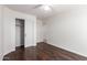 Bedroom with hardwood flooring, a closet, and a ceiling fan at 4241 E Bonanza Rd, Gilbert, AZ 85297