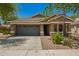 Inviting single-story home with desert landscaping and a convenient two-car garage at 4241 E Bonanza Rd, Gilbert, AZ 85297