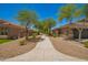Exterior sidewalk view with desert landscaping and single-story house at 4241 E Bonanza Rd, Gilbert, AZ 85297