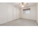 Bright bedroom with neutral carpet, ceiling fan and closet storage space at 4553 N 54Th Ave, Phoenix, AZ 85031
