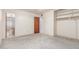 Bedroom featuring carpet flooring, bathroom access, and closet with shelves at 4553 N 54Th Ave, Phoenix, AZ 85031