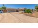 Exterior shot of the house with a long driveway at 4553 N 54Th Ave, Phoenix, AZ 85031