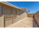 Shot of the side of house, with concrete slab leading to gated exit at 4553 N 54Th Ave, Phoenix, AZ 85031