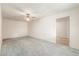 Spacious living room featuring neutral carpet and ceiling fan at 4553 N 54Th Ave, Phoenix, AZ 85031
