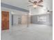 Open-concept living room with tile flooring, ceiling fans, and views to other rooms at 4553 N 54Th Ave, Phoenix, AZ 85031