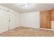 White walled empty room featuring closed white doors and concrete floors at 4553 N 54Th Ave, Phoenix, AZ 85031