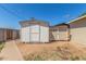 Backyard features a small white wooden shed with a second smaller door at 4553 N 54Th Ave, Phoenix, AZ 85031