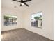 Bedroom features two windows with views of palm trees and neighborhood street at 5426 E Karen Dr, Scottsdale, AZ 85254