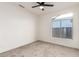Bedroom features a window and neutral walls with carpeted floors and a ceiling fan at 5426 E Karen Dr, Scottsdale, AZ 85254