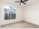 Carpeted bedroom with a large window and neutral walls offers a calming space at 5426 E Karen Dr, Scottsdale, AZ 85254