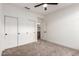 Bedroom with carpeted floors features closet space with sliding doors and access to hallway at 5426 E Karen Dr, Scottsdale, AZ 85254