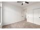 Bedroom featuring carpeted floors, closet space, and access to hallway at 5426 E Karen Dr, Scottsdale, AZ 85254