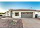 Charming home with a tile roof, two-car garage, and low-maintenance desert landscaping at 5426 E Karen Dr, Scottsdale, AZ 85254