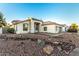 Charming single-story home with a well-manicured rock front yard and neutral color palette at 5426 E Karen Dr, Scottsdale, AZ 85254