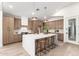 Modern kitchen with sleek cabinetry, a large center island, and stylish pendant lighting at 5426 E Karen Dr, Scottsdale, AZ 85254