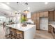 Well-lit kitchen with a large island, modern fixtures, and a seamless transition to the dining area at 5426 E Karen Dr, Scottsdale, AZ 85254