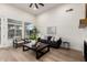 Cozy living room with hardwood floors, modern furniture, and access to outdoor space at 5426 E Karen Dr, Scottsdale, AZ 85254