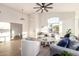 Inviting living room showcasing a neutral color scheme, arched windows, and stylish decor at 5426 E Karen Dr, Scottsdale, AZ 85254