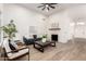 Comfortable living area with a fireplace, contemporary decor, and plenty of natural light at 5426 E Karen Dr, Scottsdale, AZ 85254