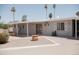 Backyard with a patio, a small garden area, and a view of the house's exterior at 5602 W Heatherbrae Dr, Phoenix, AZ 85031