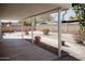 Relaxing covered patio overlooking the large, landscaped backyard with stone at 5602 W Heatherbrae Dr, Phoenix, AZ 85031