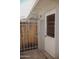 Entrance to backyard shows fence and gate for privacy and security at 5602 W Heatherbrae Dr, Phoenix, AZ 85031