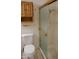 Bathroom featuring a toilet and a shower with gold trim for easy access at 5602 W Heatherbrae Dr, Phoenix, AZ 85031