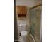 Well-maintained bathroom features a shower, toilet, and classic wooden vanity at 5602 W Heatherbrae Dr, Phoenix, AZ 85031