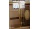 Bathroom with glass doors, showerhead, and window offering natural light and ventilation at 5602 W Heatherbrae Dr, Phoenix, AZ 85031