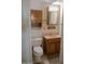 Comfortable bathroom with classic vanity and fixtures, next to the doorway at 5602 W Heatherbrae Dr, Phoenix, AZ 85031