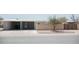 Charming single-story home with two-car carport, block fence, and minimalist landscaping at 5602 W Heatherbrae Dr, Phoenix, AZ 85031
