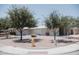 Charming single-story home with desert landscaping, a yellow fire hydrant, and mature shade trees at 5602 W Heatherbrae Dr, Phoenix, AZ 85031