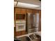 The kitchen features stainless steel refrigerator, built-in oven, and wood cabinetry at 5602 W Heatherbrae Dr, Phoenix, AZ 85031