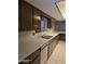 The kitchen features light countertops and wooden cabinets at 5602 W Heatherbrae Dr, Phoenix, AZ 85031