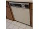 Close-up of a retro white dishwasher featuring a chrome handle at 5602 W Heatherbrae Dr, Phoenix, AZ 85031
