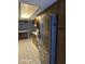 The kitchen features a stainless steel refrigerator, wooden cabinets, and tile floors at 5602 W Heatherbrae Dr, Phoenix, AZ 85031