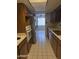 The kitchen features a tile floor, light countertops, stainless steel appliances and wooden cabinets at 5602 W Heatherbrae Dr, Phoenix, AZ 85031
