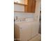 Clean laundry area featuring a modern white washer and dryer set for convenient chores at 5602 W Heatherbrae Dr, Phoenix, AZ 85031