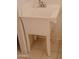 A utility room with a white plastic sink and tile flooring at 5602 W Heatherbrae Dr, Phoenix, AZ 85031