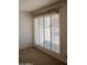 The image shows a window with white shutters and decorative valance allowing natural light at 5602 W Heatherbrae Dr, Phoenix, AZ 85031