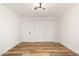 Empty bedroom boasting a spacious layout, wood-look flooring, and a closet, providing a blank canvas for personalization at 5951 W Granada Rd, Phoenix, AZ 85035