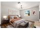 Cozy bedroom with a plush bed, stylish decor, and natural light streaming through the window, creating a relaxing atmosphere at 5951 W Granada Rd, Phoenix, AZ 85035