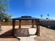 Backyard gazebo offering a shady retreat on a sunny day, perfect for relaxation and outdoor enjoyment at 5951 W Granada Rd, Phoenix, AZ 85035