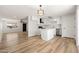 Modern kitchen with white cabinets, stainless steel appliances, and natural light at 5951 W Granada Rd, Phoenix, AZ 85035