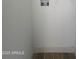 Laundry room hookups with water inlets and electrical outlets on a white wall with a wooden floor at 5951 W Granada Rd, Phoenix, AZ 85035