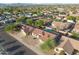 Aerial view of a neighborhood featuring homes with red tile roofs, green trees, and a community pool at 6805 S 14Th St, Phoenix, AZ 85042