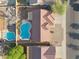 Overhead view of homes with red tile roofs, showcasing backyards with swimming pools in a planned community at 6805 S 14Th St, Phoenix, AZ 85042